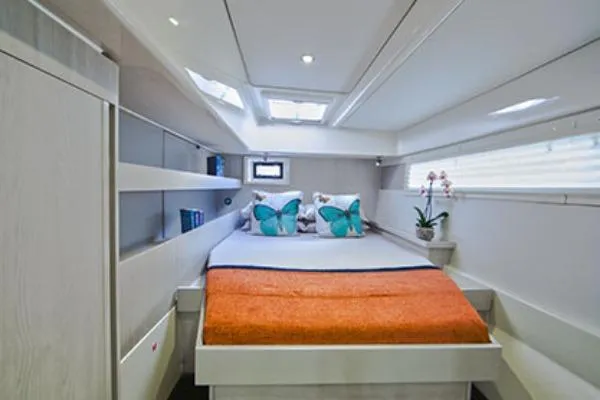 Slide: The Image of Luxurious bedroom interior in a 2015 Leopard 48 yacht, featuring modern design and skylights. - 30
