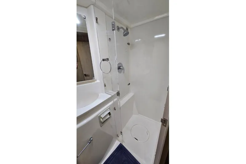 Slide: The Image of Compact bathroom in a 2015 Leopard 48 yacht, featuring a shower and sink. - 35