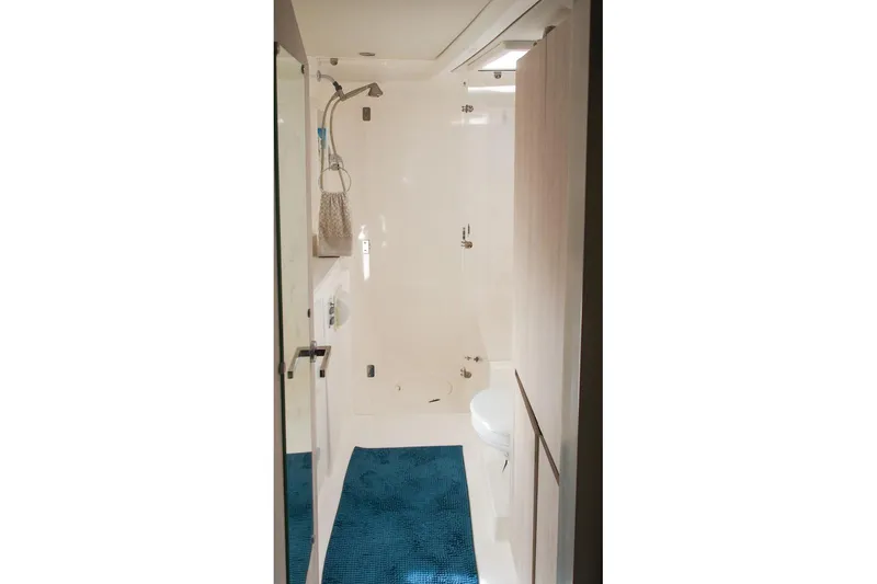 Slide: The Image of Bathroom interior of 2015 Leopard 48 yacht with shower and blue mat. - 38