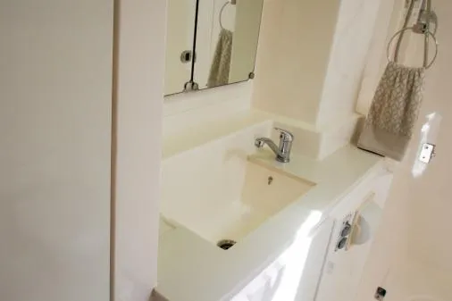 Slide: The Image of Modern bathroom sink in a 2015 Leopard 48 yacht, featuring sleek design and fixtures. - 39