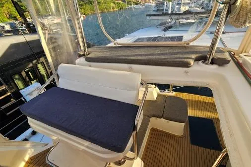 Slide: The Image of Flybridge of 2015 Leopard 48 yacht with seating and marina view. - 43