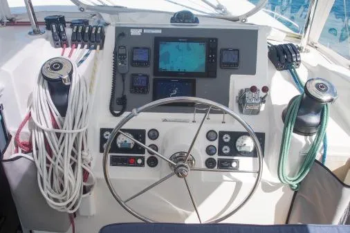 Slide: The Image of Helm of 2015 Leopard 48 yacht with navigation equipment and steering wheel. - 46