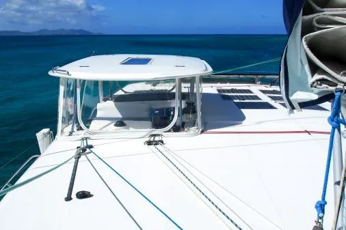 Slide: The Image of 2015 Leopard 48 catamaran sailing on clear blue ocean waters. - 49