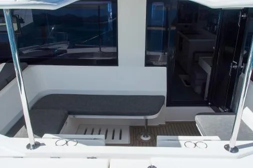 Slide: The Image of 2015 Leopard 48 yacht interior with cushioned seating and sleek design. - 51