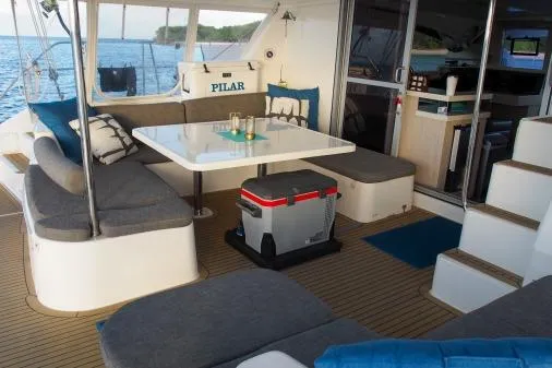 Slide: The Image of Spacious Leopard 48 catamaran interior, featuring a dining area with cushioned seating, 2015 model. - 55