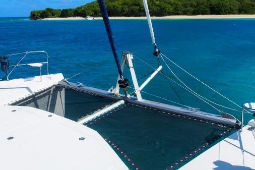 Slide: The Image of 2015 Leopard 48 catamaran sailing near tropical island with clear blue waters. - 57