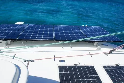 Slide: The Image of Solar panels on a 2015 Leopard 48 yacht, sailing in clear blue waters. - 62