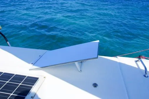 Slide: The Image of Leopard 48 yacht with solar panel, 2015 model, on clear blue ocean water. - 63