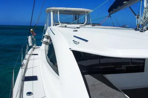 Slide: The Image of 2015 Leopard 48 yacht sailing on clear blue ocean waters. - 65