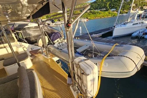 Slide: The Image of Leopard 48 yacht deck with inflatable boat, docked at marina, sunny day. - 66