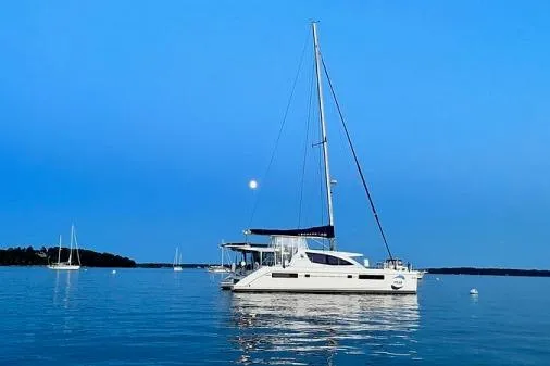 Slide: The Image of Leopard 48 catamaran sailing on calm waters at sunset, 2015 model. - 69