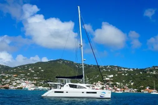 Slide: The Image of 2015 Leopard 48 catamaran sailing near scenic coastline under blue sky. - 70