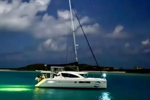 Slide: The Image of 2015 Leopard 48 catamaran at night on calm waters. - 72