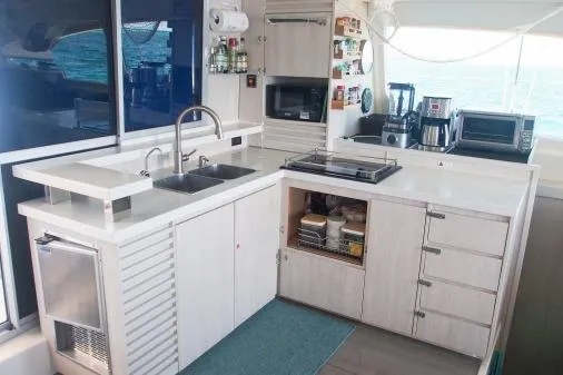 Slide: The Image of Modern kitchen on 2015 Leopard 48 yacht with appliances and ocean view. - 8