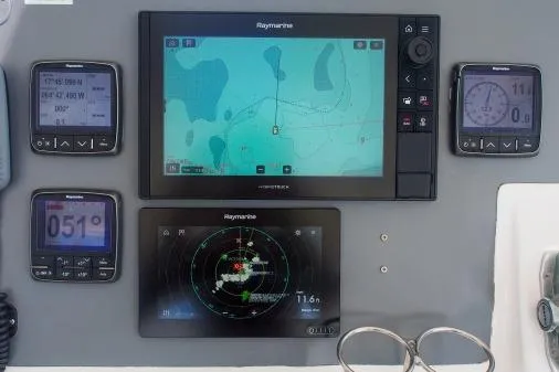 Slide: The Image of Navigation system on a 2015 Leopard 48 yacht, featuring Raymarine displays and instruments. - 82