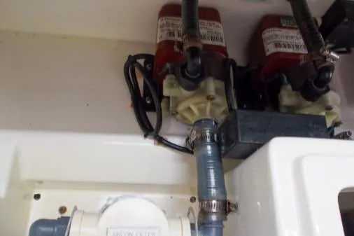 Slide: The Image of Engine compartment of a 2015 Leopard 48 yacht with visible wiring and components. - 85