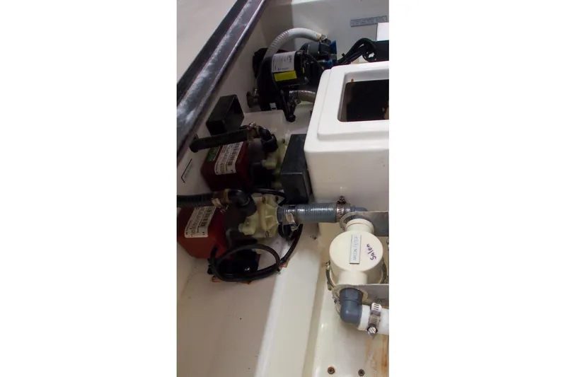 Slide: The Image of Engine compartment of a 2015 Leopard 48 yacht, featuring various mechanical components. - 86