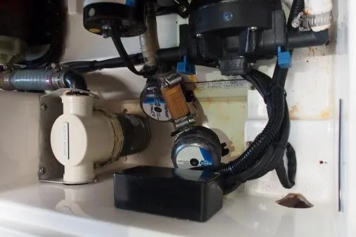 Slide: The Image of Engine compartment of a 2015 Leopard 48 yacht, showcasing mechanical components and wiring. - 87