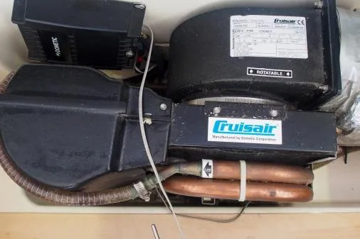 Slide: The Image of Cruisair unit in a 2015 Leopard 48 yacht, featuring copper piping and electrical components. - 88