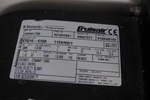 Slide: The Image of Label on Dometic Cruisair unit, model STQ16-410A, featuring technical specifications and contact information. - 90