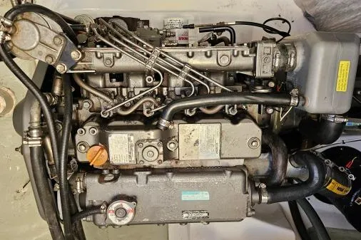 Slide: The Image of Engine of a 2015 Leopard 48 yacht, showcasing intricate mechanical components. - 91