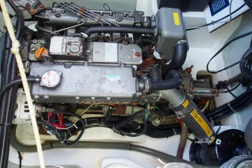 Slide: The Image of Engine compartment of a 2015 Leopard 48 yacht, showcasing mechanical components and wiring. - 92