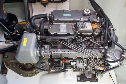 Slide: The Image of Engine of a 2015 Leopard 48 yacht, showcasing intricate mechanical components. - 94