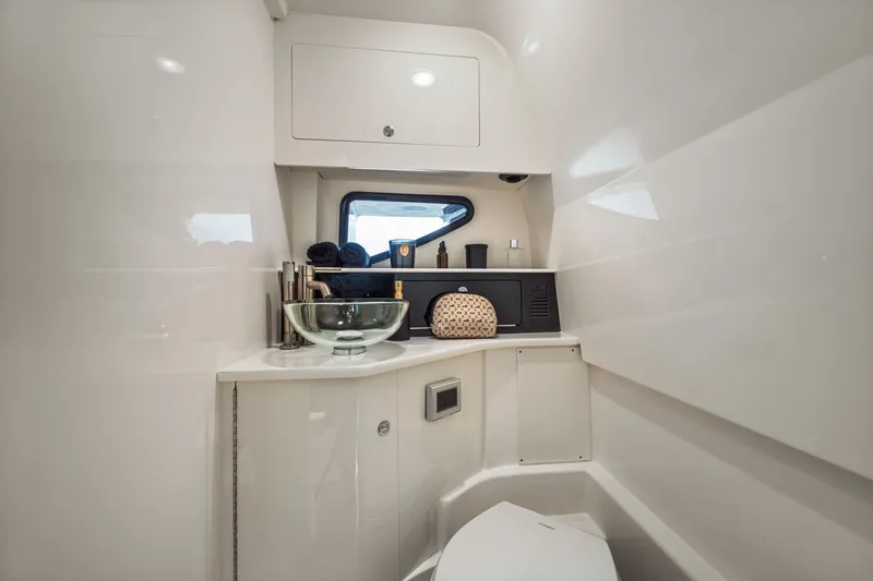Slide: The Image of Modern bathroom with glass sink and sleek decor on a boat. - 23