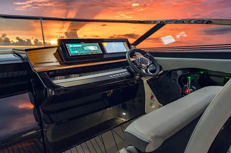 Slide: The Image of The Sea Ray SLX 360 Outboard cockpit features modern instruments and sleek design at sunset. - 4