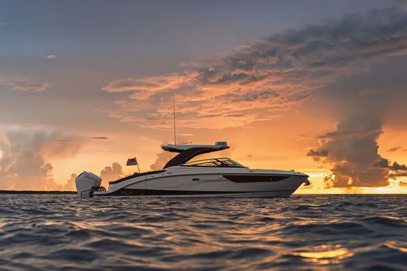 Slide: The Image of Sea Ray SLX 360 Outboard 2026 on the water at sunset. - 0