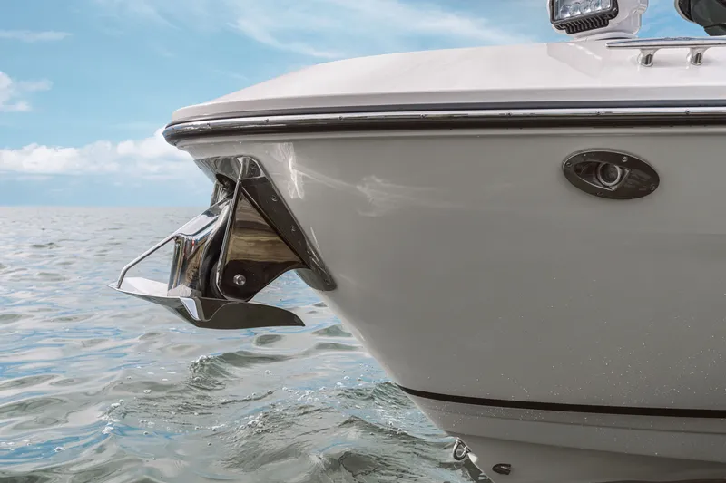 Slide: The Image of The 2026 Sea Ray SLX 360 Outboard features its sleek bow anchor on calm waters. - 14
