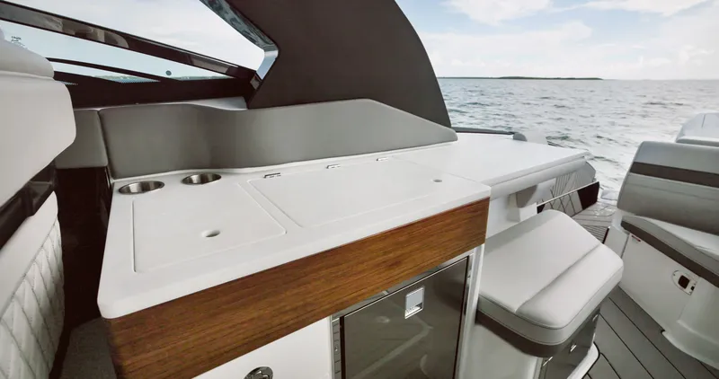 Slide: The Image of The image shows the cockpit of a 2026 Sea Ray SLX 360 Outboard with sleek seating and modern design. - 21