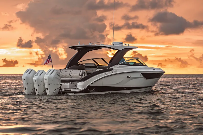 Slide: The Image of Sea Ray SLX 360 Outboard 2026 on the water at sunset. - 1