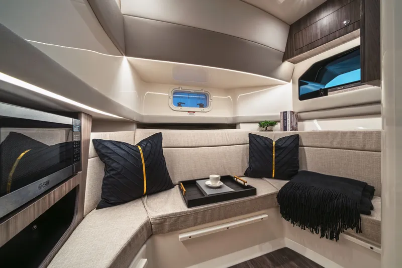 Slide: The Image of Interior of the 2026 Sea Ray SLX 360 Outboard with a stylish seating area and modern amenities. - 18
