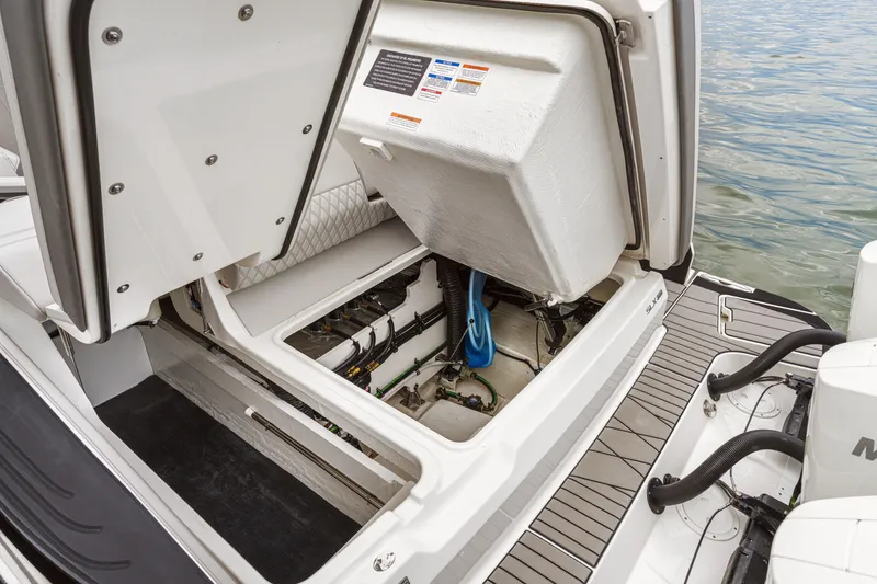 Slide: The Image of 2026 Sea Ray SLX 360 Outboard with open storage hatch, revealing interior mechanics and equipment. - 27