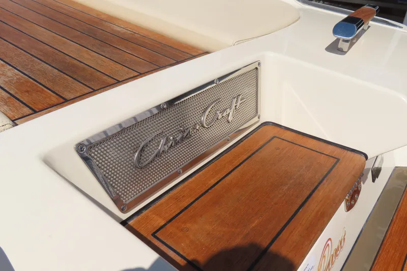 Slide: The Image of 2018 Chris Craft Launch 34 boat with teak wood detailing and logo plate. - 12