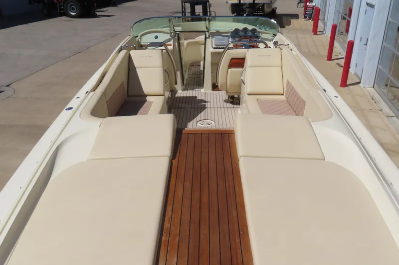 Slide: The Image of 2018 Chris Craft Launch 34 boat with elegant seating and wooden deck. - 15