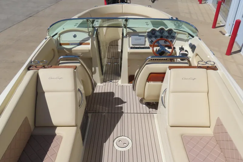 Slide: The Image of 2018 Chris Craft Launch 34 boat interior with luxurious seating and elegant dashboard design. - 17