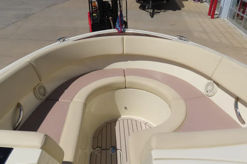 Slide: The Image of 2018 Chris Craft Launch 34 boat interior with beige seating and wood flooring. - 22