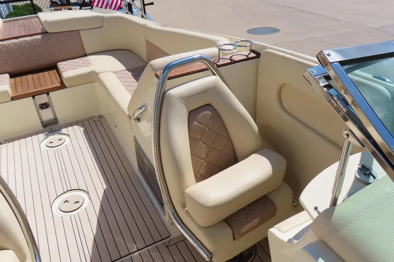 Slide: The Image of Luxurious interior of 2018 Chris Craft Launch 34 boat with beige seating and wood accents. - 24