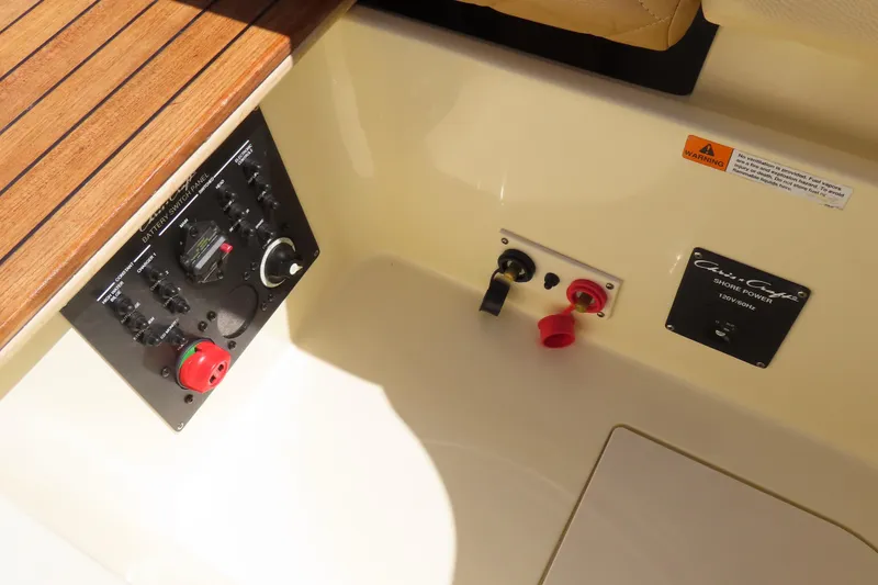 Slide: The Image of 2018 Chris Craft Launch 34 battery switch panel and shore power controls. - 27