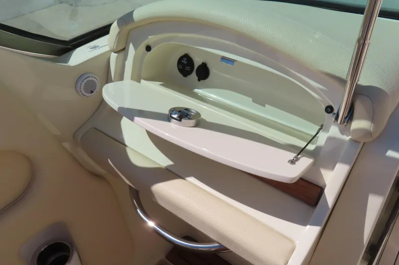 Slide: The Image of 2018 Chris Craft Launch 34 interior detail with storage compartment and speaker. - 34