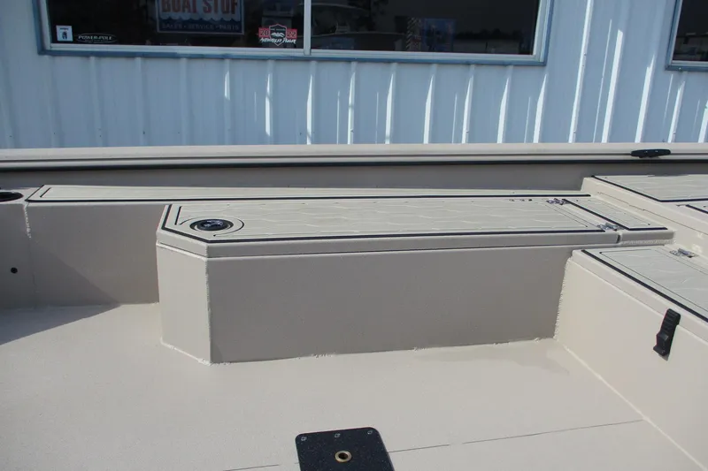 Slide: The Image of 2026 Avid 18 Commander boat interior with storage compartments and sleek design. - 11