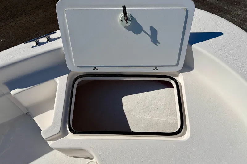 Slide: The Image of Open storage compartment on a 2010 Carolina Skiff 192 DLV boat. - 11