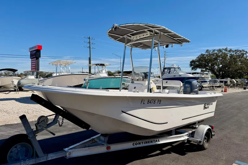 Slide: The Image of 2010 Carolina Skiff 192 DLV boat on trailer in sunny dealership lot. - 2