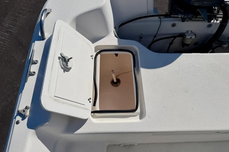 Slide: The Image of Open storage compartment on a 2010 Carolina Skiff 192 DLV boat deck. - 21