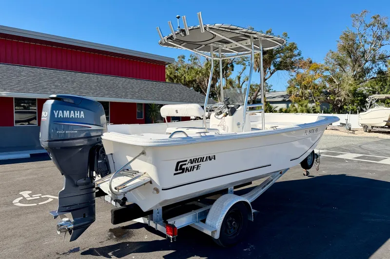 Slide: The Image of 2010 Carolina Skiff 192 DLV boat with Yamaha outboard motor on trailer. - 5