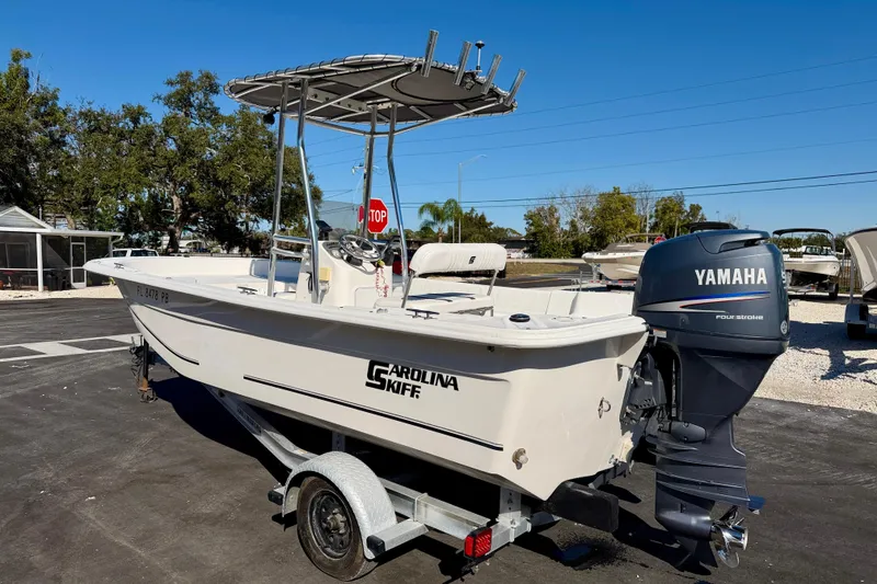 Slide: The Image of 2010 Carolina Skiff 192 DLV boat with Yamaha outboard motor on trailer. - 7