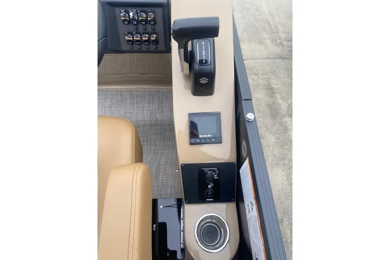 Slide: The Image of Control panel of 2026 Manitou 25 Encore RF VPII boat with switches and display. - 15