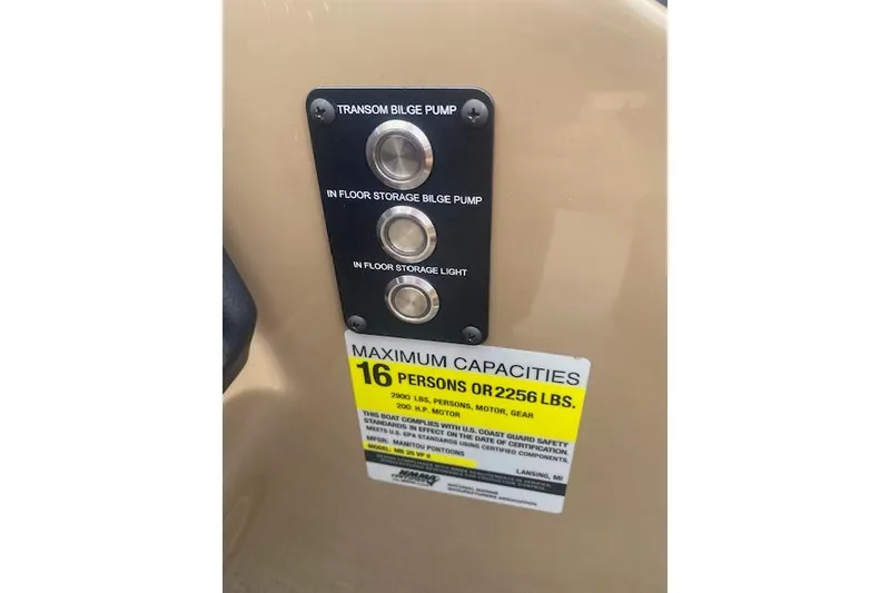 Slide: The Image of Control panel and capacity label on 2026 Manitou 25 Encore RF VPII boat. - 17